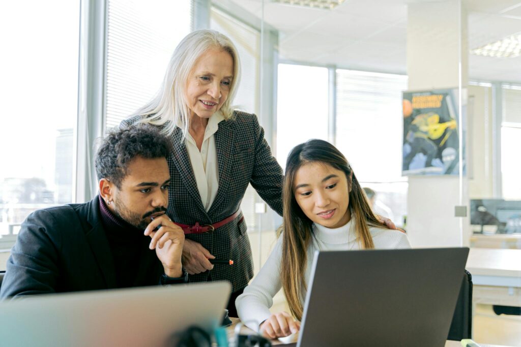 A diverse group of professionals engaged in a collaborative office meeting.